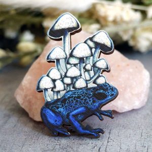 wooden badge blue frog mushrooms