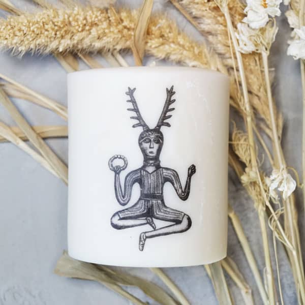 White soy candle depicting Cernunnos
