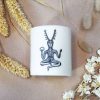 Handmade white soy candle depicting Cernunnos