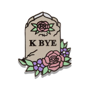 Gravestone surrounded by flowers stating: k bye