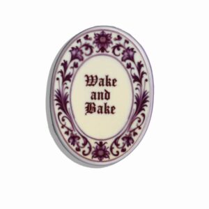 Dutch ceramic tile with the text Wake and Bake on it in delftsblauw