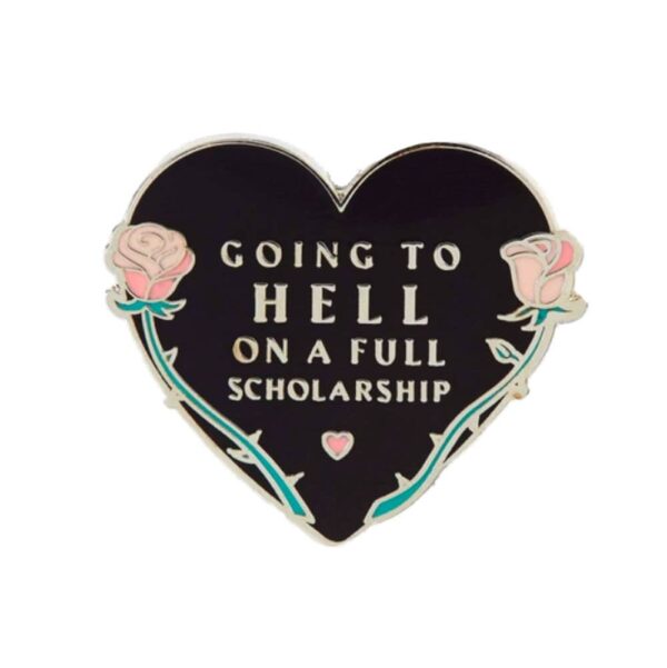 Heart shaped hard enamel pin with the text going to hell on a full scholarship.