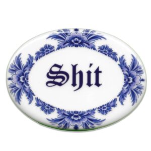 Blue oval ceramic tile saying shit
