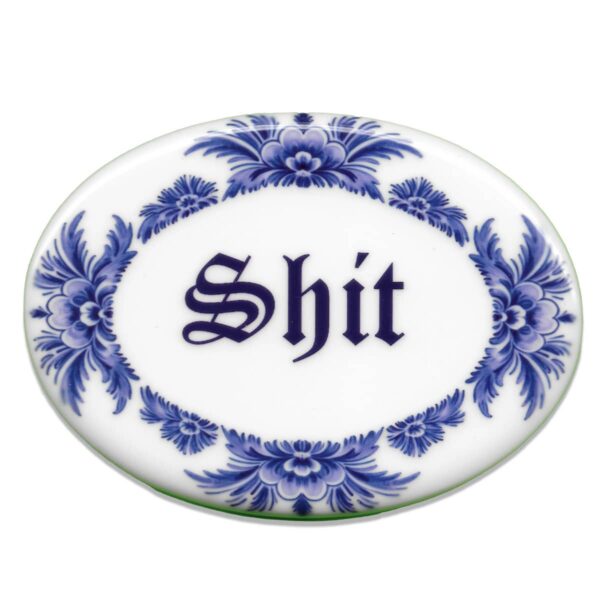 Blue oval ceramic tile saying shit