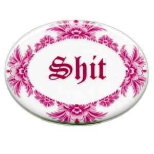 Oval ceramic tile in pink saying shit